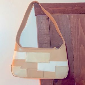 Super cute bag! It looks so good on your shoulder and is surprisingly big inside